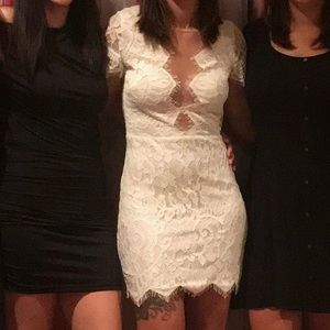 White lace detail dress. Size small. Lace over chest is nude to blend to skin.